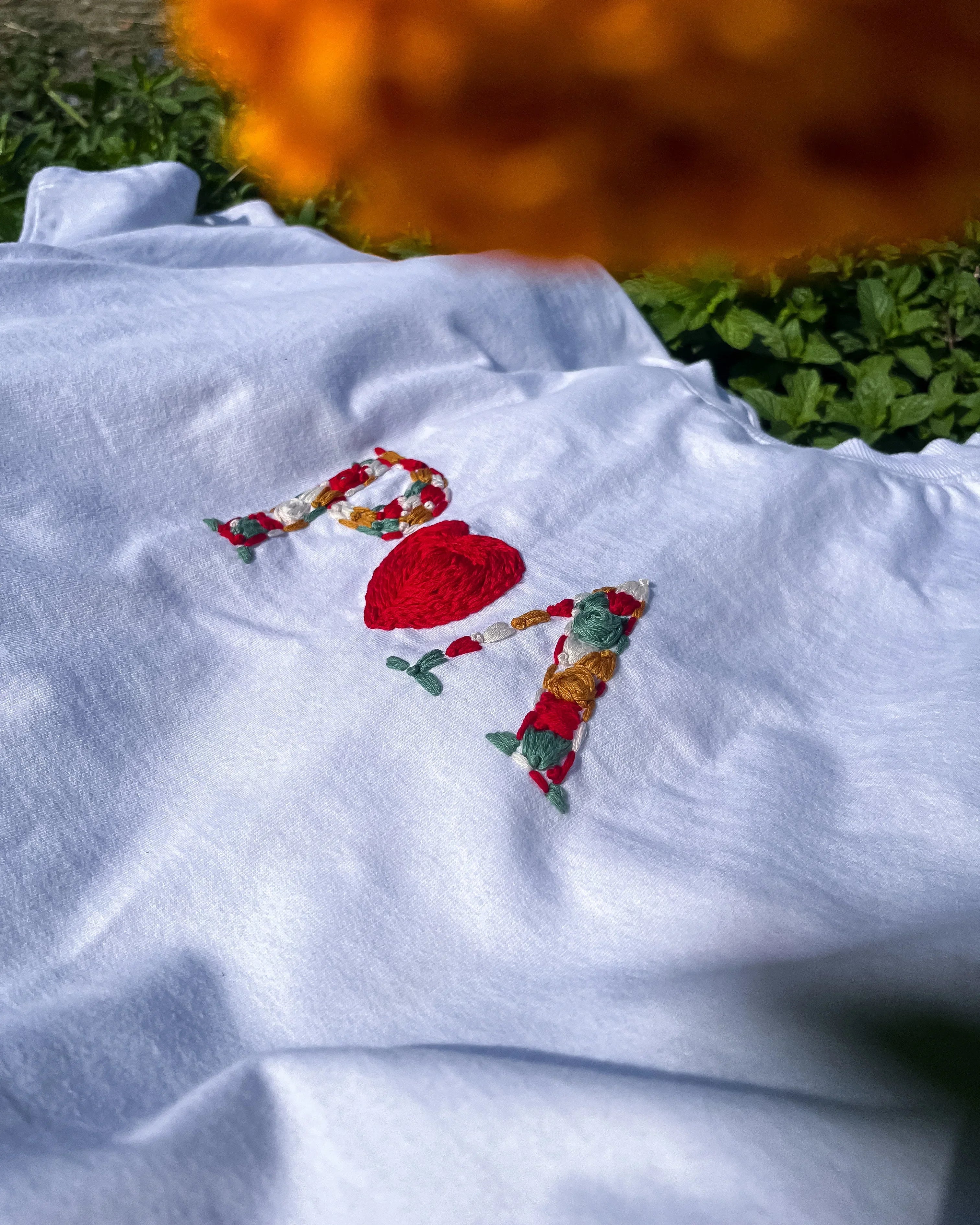 Karva Chauth gift for wife — hand-embroidered initials inside a heart on a white cotton t-shirt
