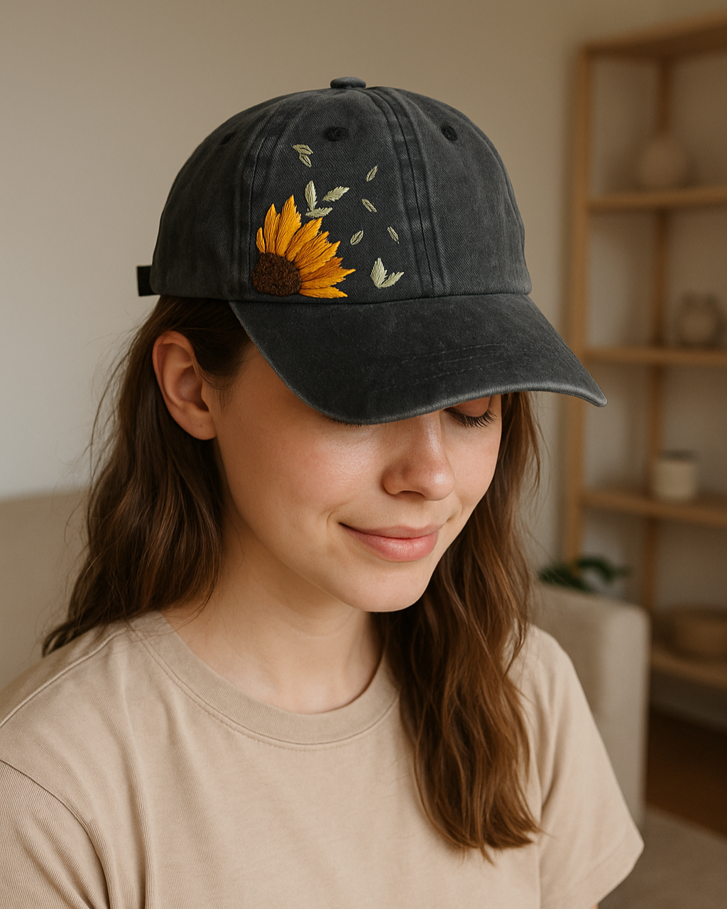 Person wearing a black cap with a sunflower embridoered design indoors