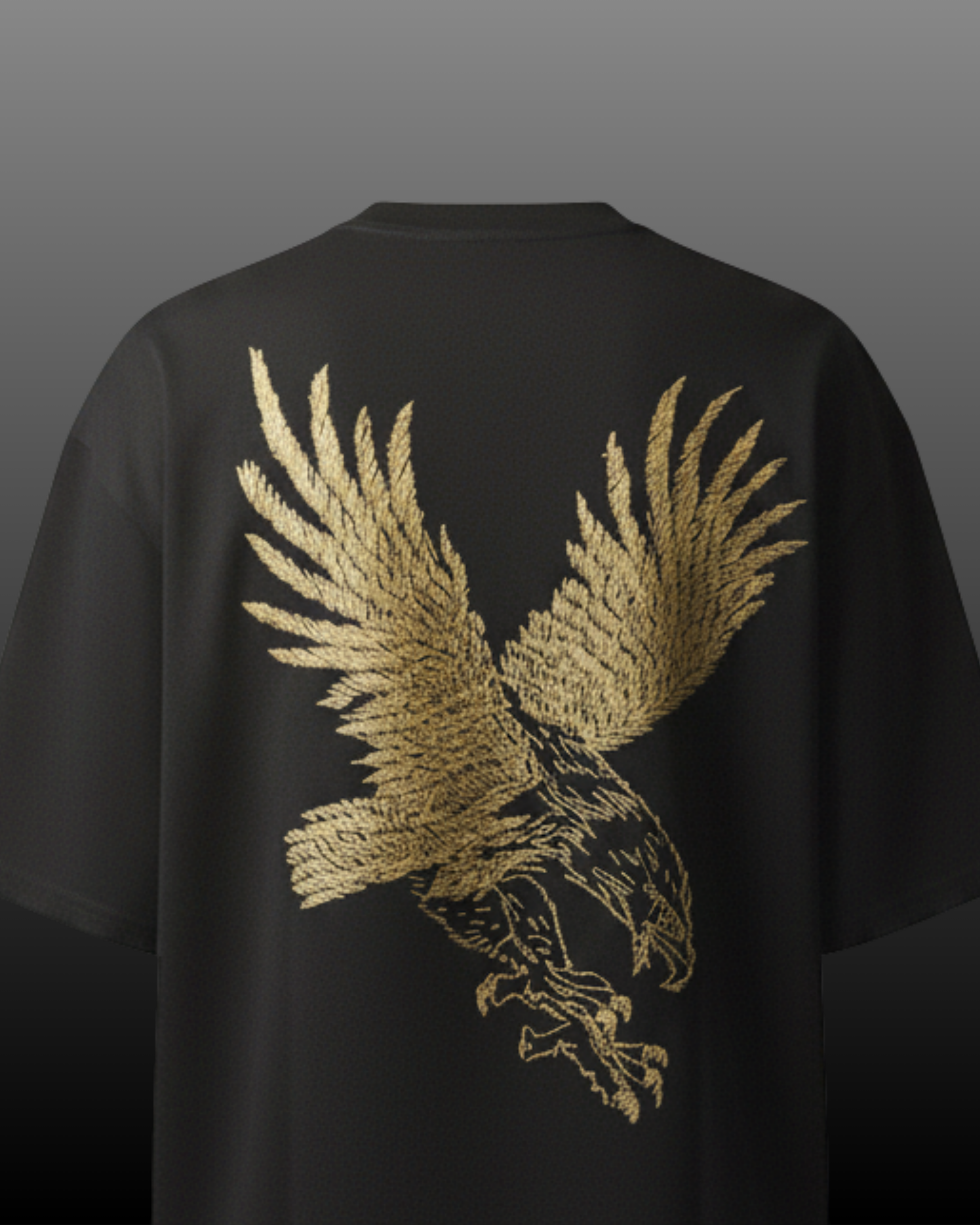Black t-shirt with a gold eagle design embroidered on the back against a dark background