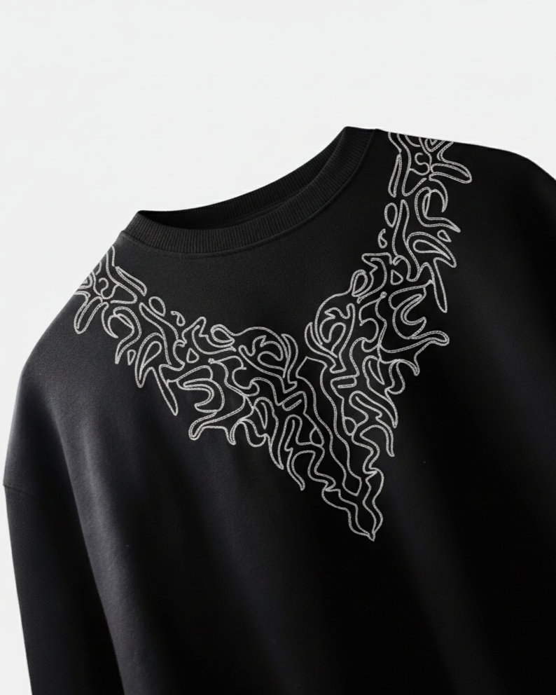 Black sweatshirt with white geometric pattern embroidered on a light gray background