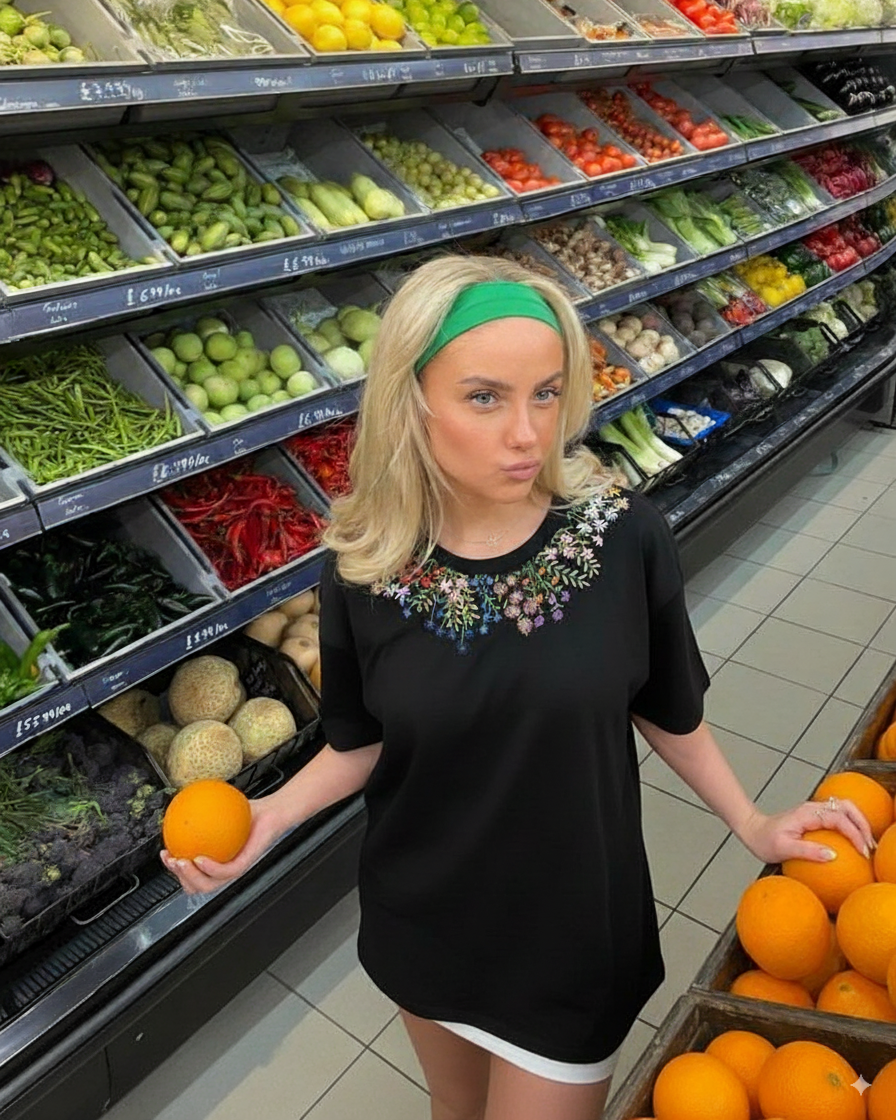 Woman is wearing a floral embroidered tshirt