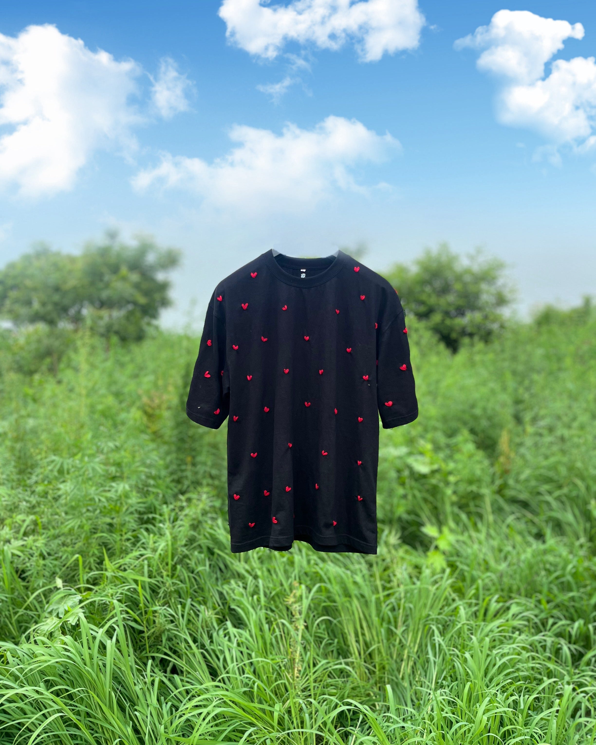 Minimal white shirt featuring hand-stitched red heart