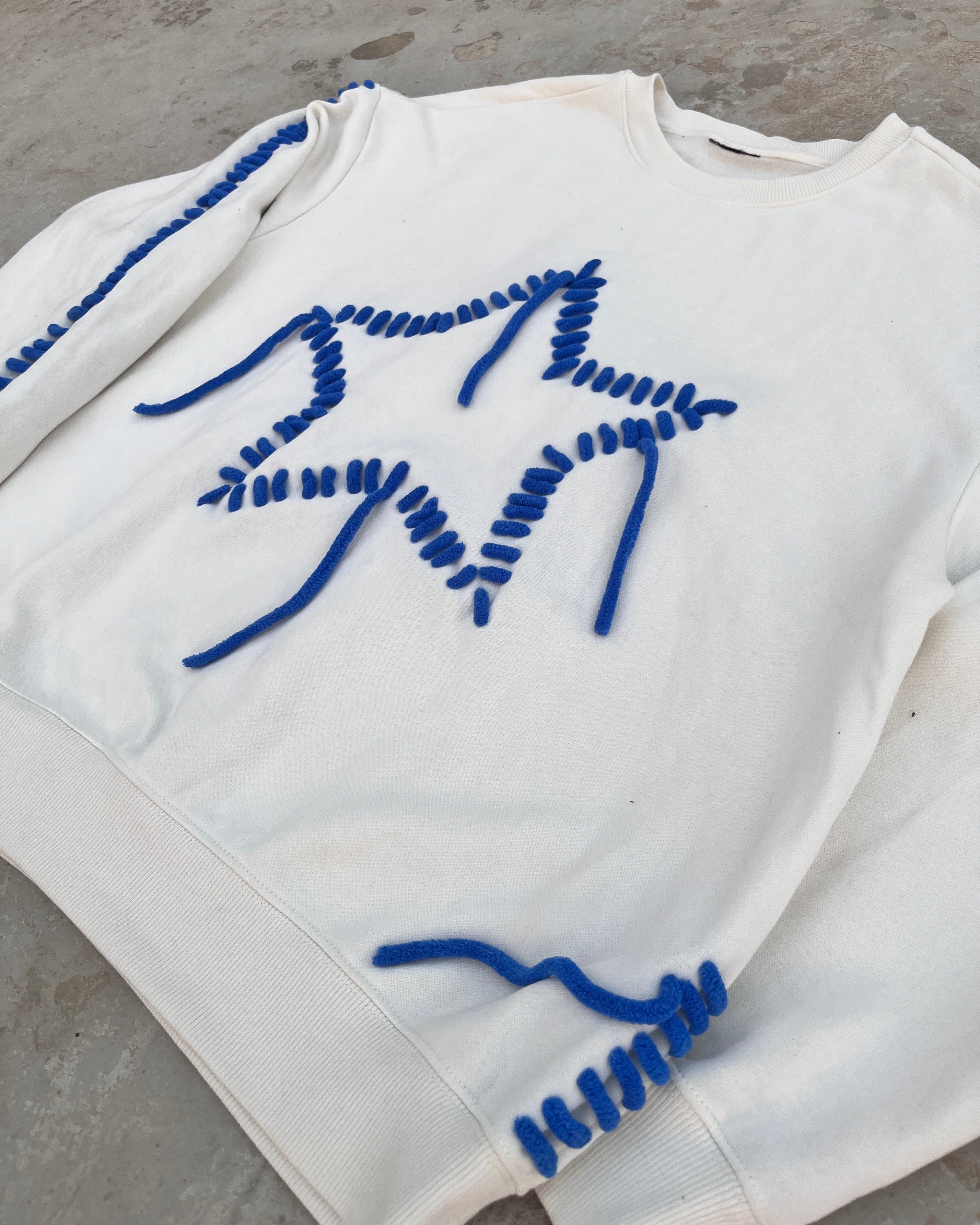 close up of embroidered hoodie