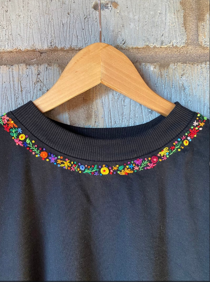 Neck floral blossom hand embroidered tee — close-up showing thread detail along neckline, premium 220 GSM cotton