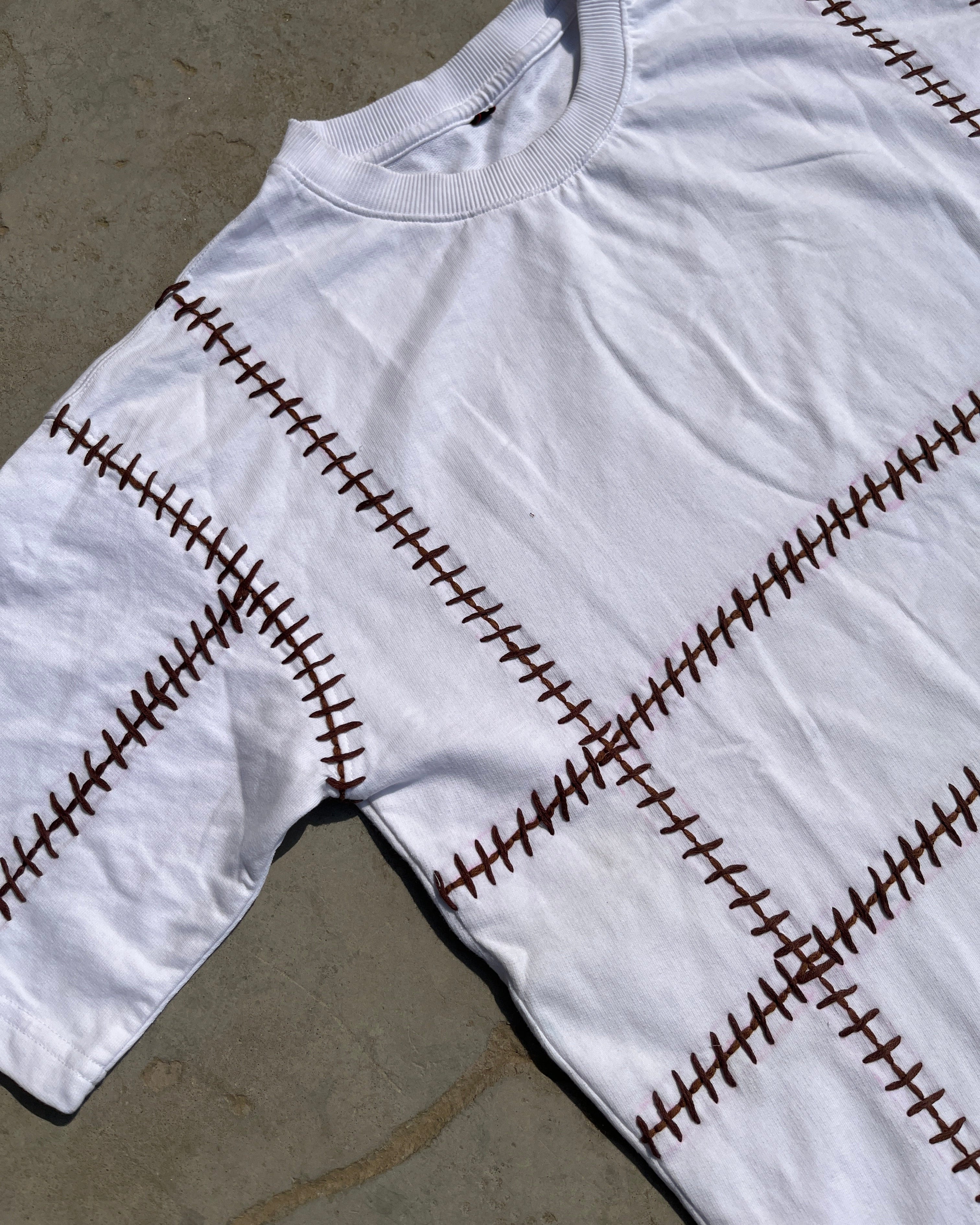 close up of hand embroidered Oversized T-shirt (Unisex) - Vee Threads