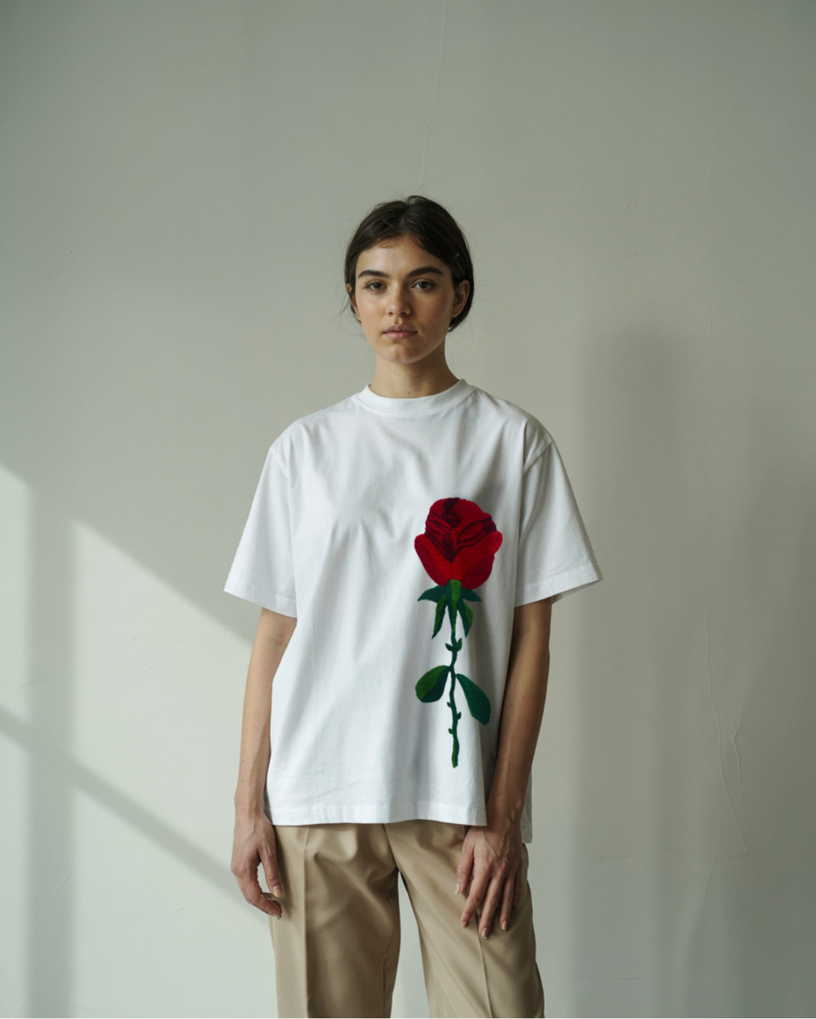 feame model wearing Rose Petal Hand-Embroidered Oversized T-shirt (Unisex) - Vee Threads