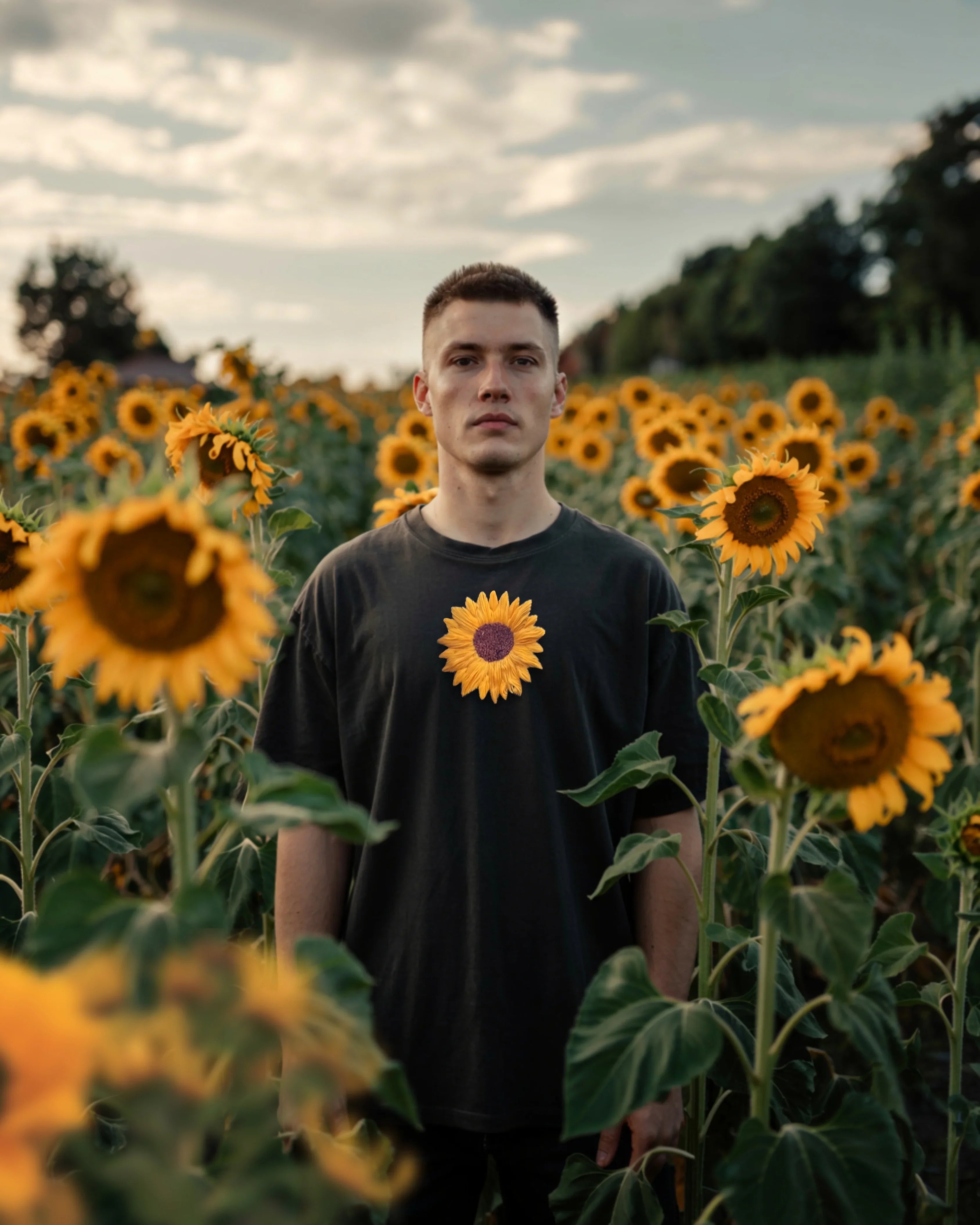 Model showcasing hand-embroidered sunflower on relaxed fit cotton t-shirt