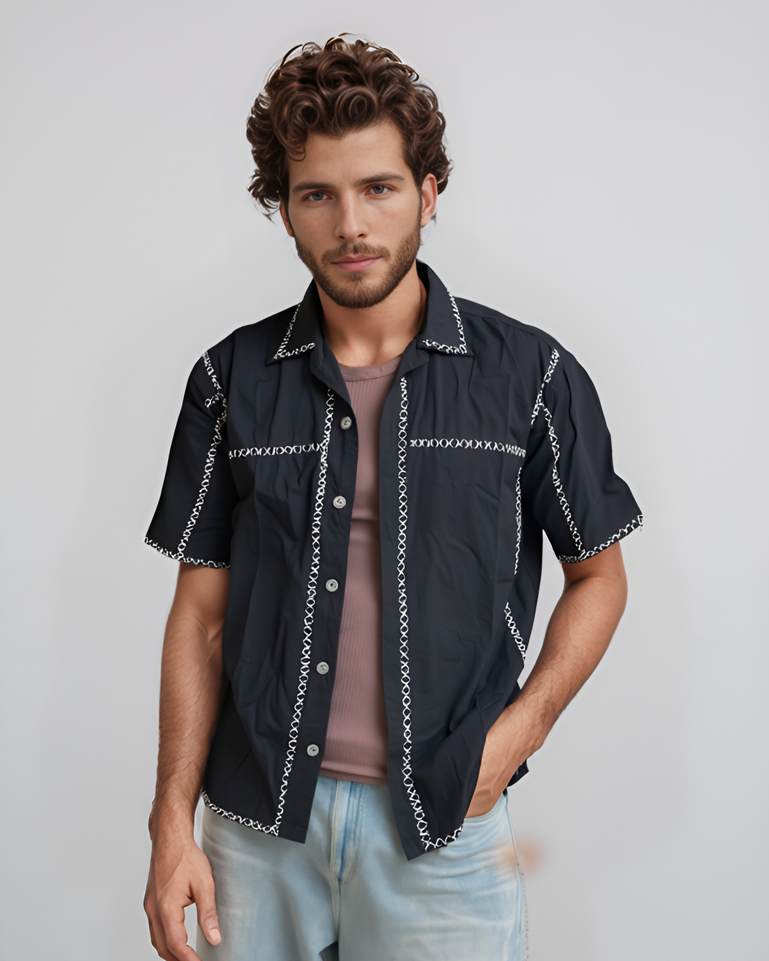 Model wearing Kala X shirt with hand-stitched cross-stitch embroidery on black cotton