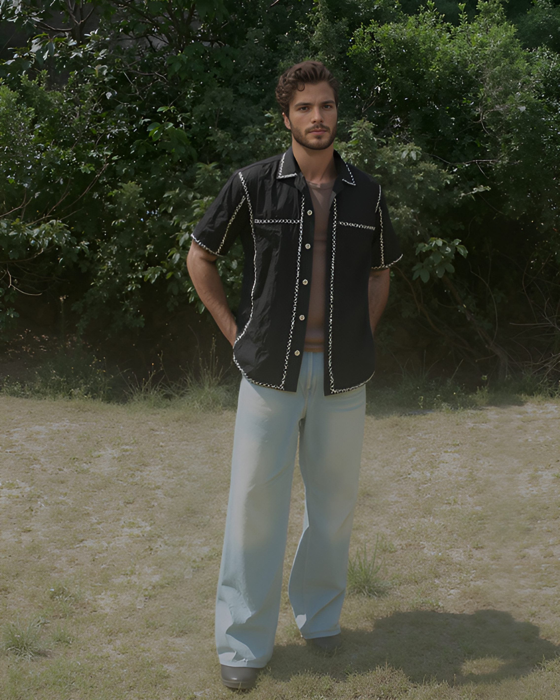 Unisex model styling hand-embroidered Kala X shirt with jeans in an outdoor setting