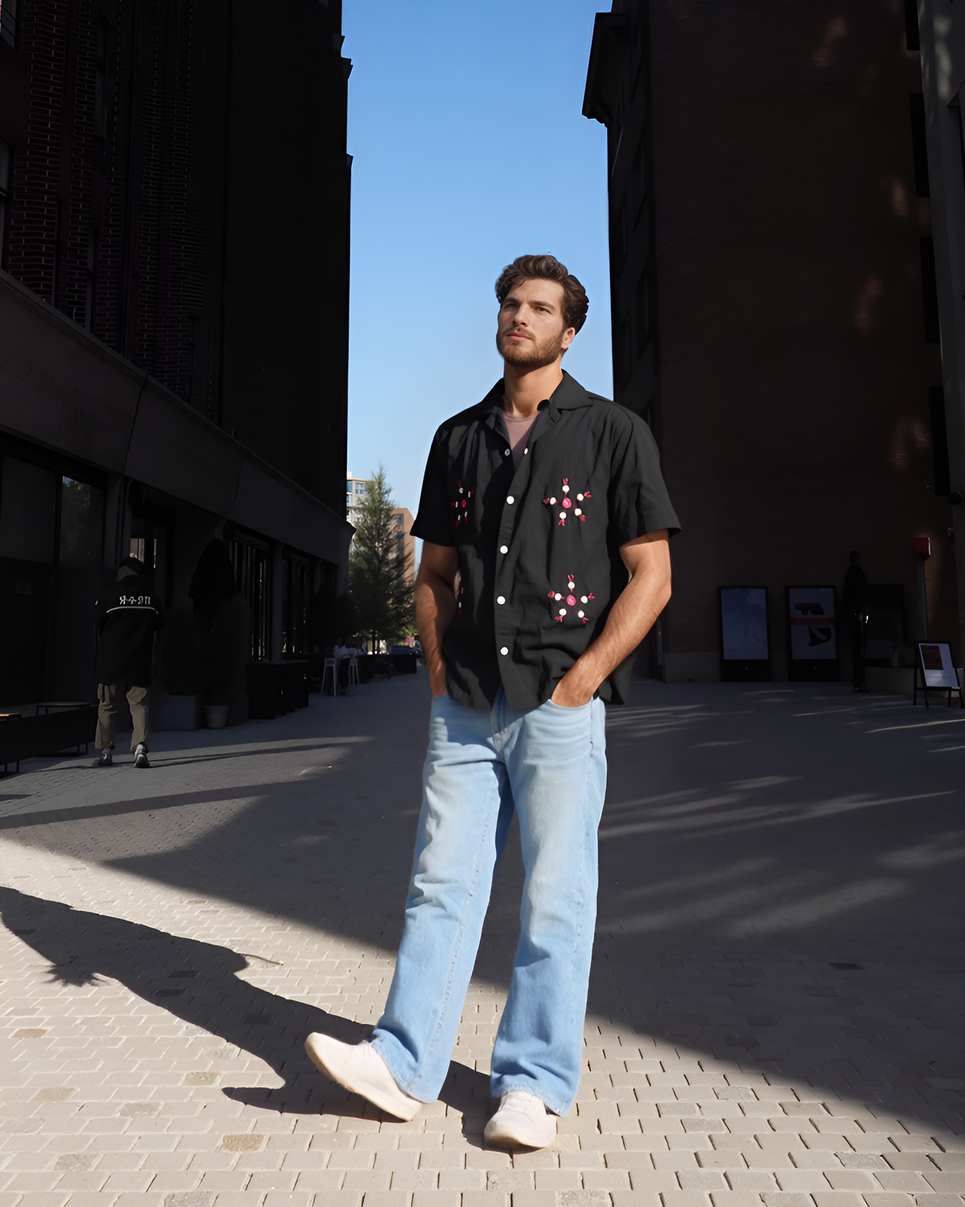 Men wearing hand-embroidered Shisha Chakra mirror work shirt in natural light