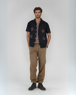 Model styling embroidered mirror shirt in boho outfit for outdoor lookbook