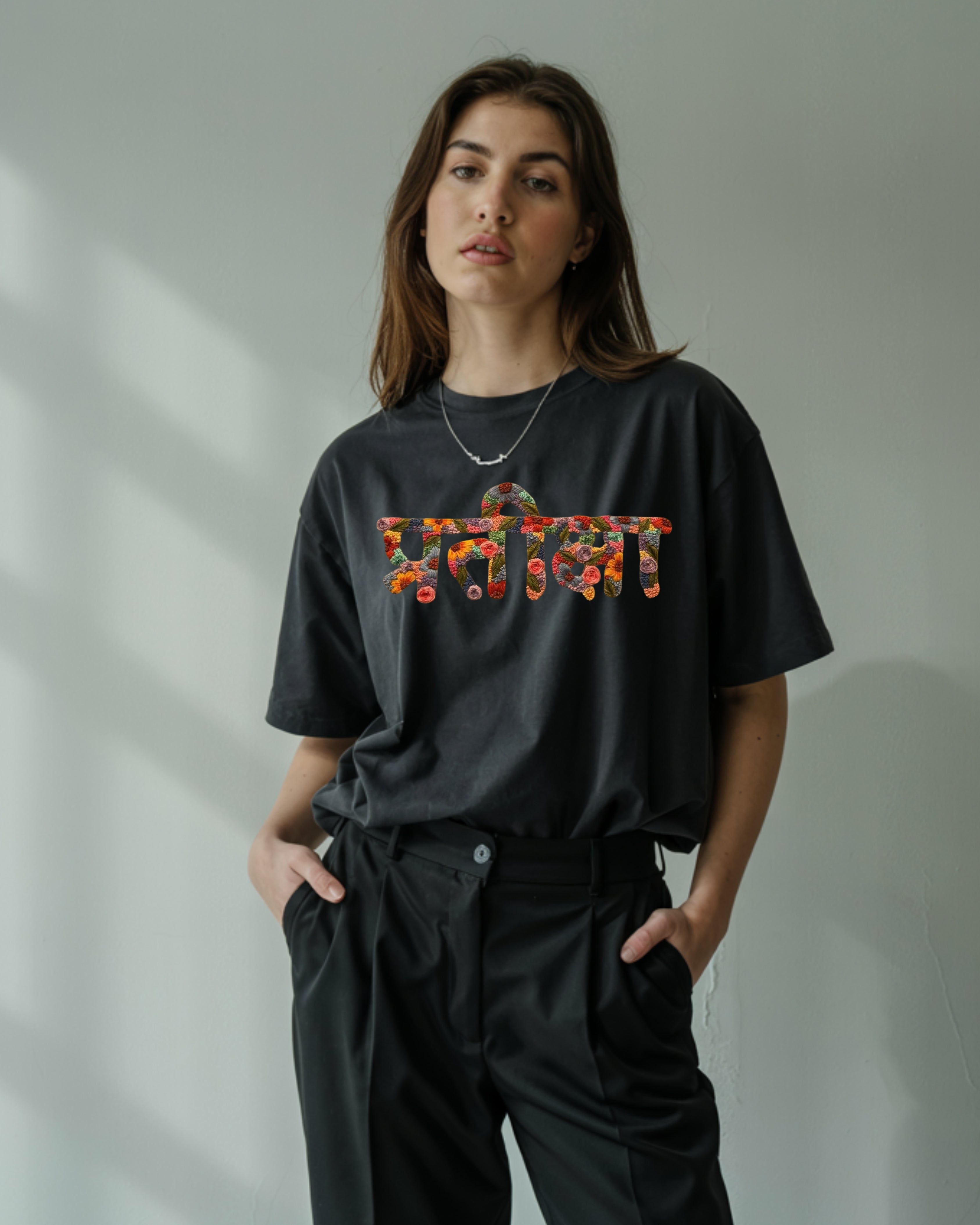 Female model in oversized Hindi Name Hand Embroidery , styled with chunky sneakers for a Gen Z vibe.