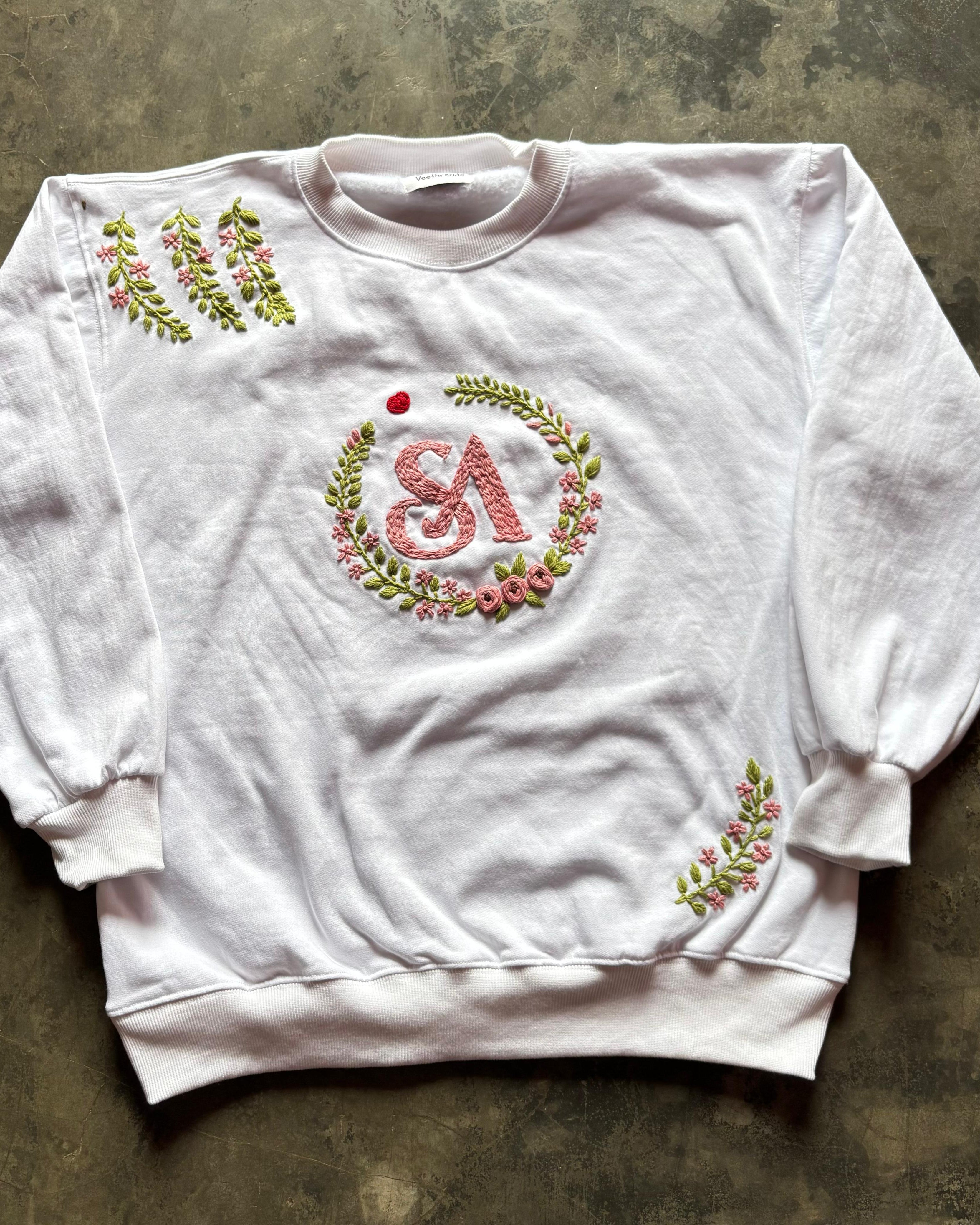 white hand-embroidered sweatshirt with couple monogram A & S inside blush floral wreath