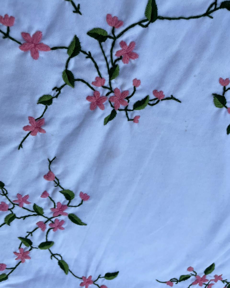 cherry blossom vine hand embroidery detail on sweatshirt