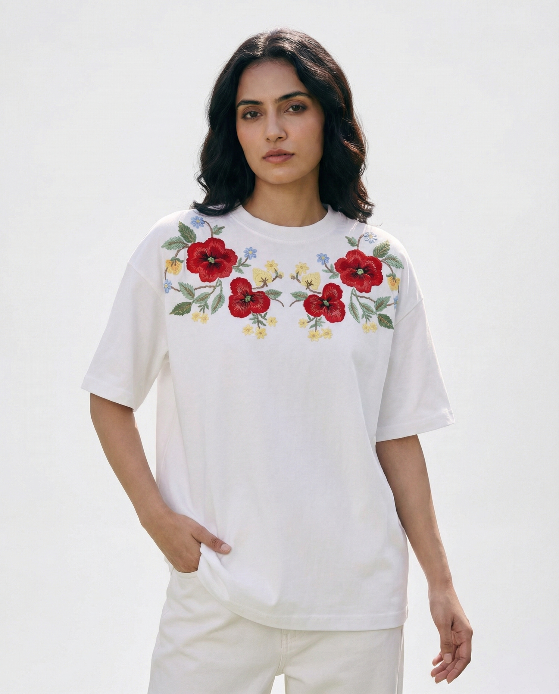 Woman wearing a White embroidery tshirt with red floral hand stitching on premium cotton
