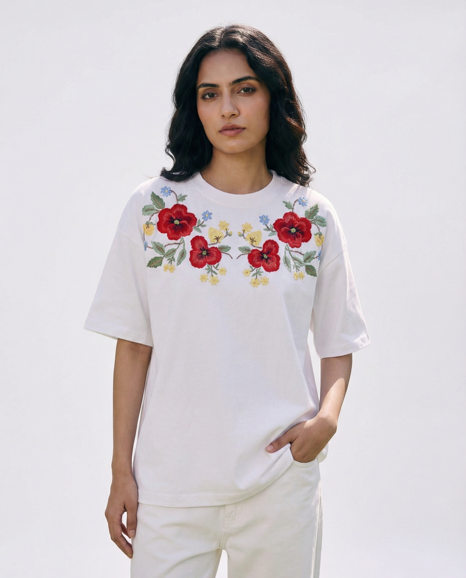 Woman wearing a Oversized embroidered polo shirts featuring vintage floral design