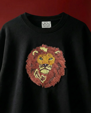 Lion hand-embroidered on a black 240 GSM cotton oversized tee — bold lion face in real thread, oversized unisex fit.