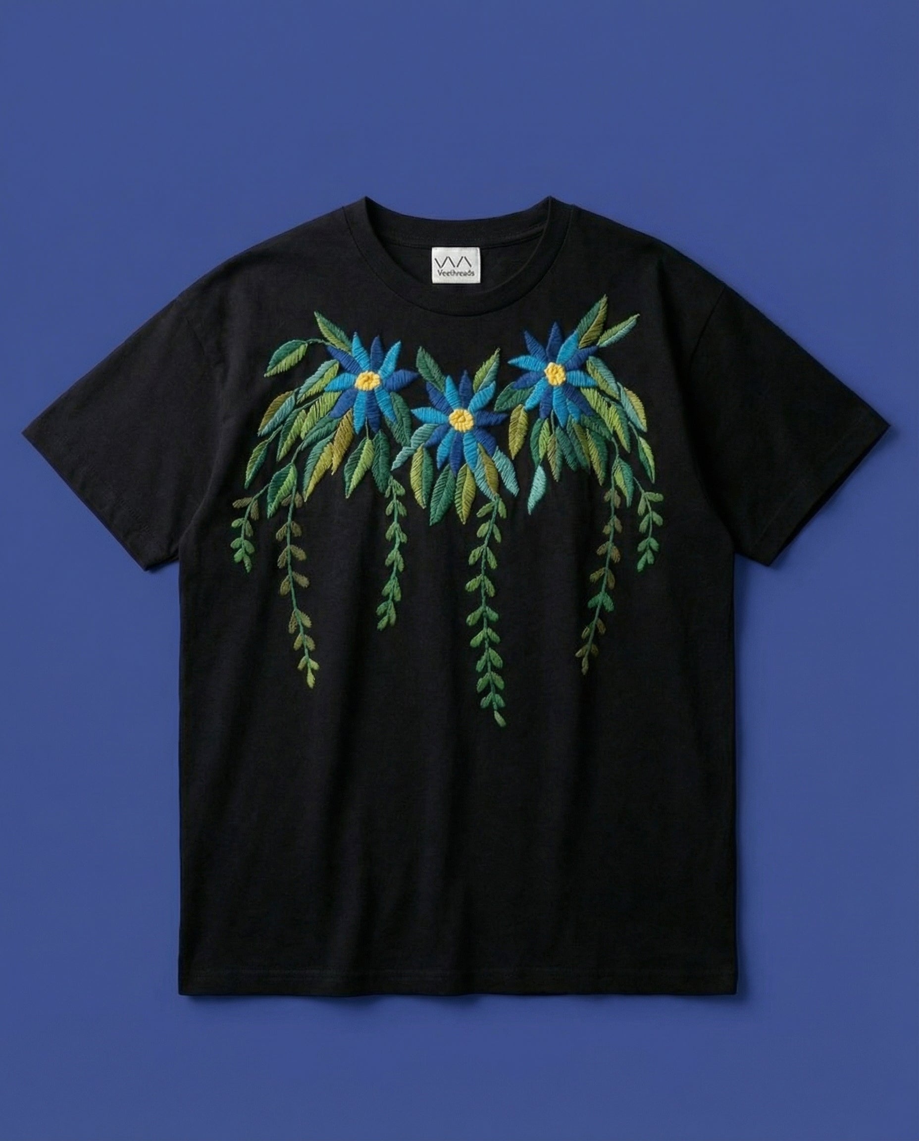 Embroidery designs t shirt floral azure — black cotton tee with hand-embroidered azure floral motif on blue background
