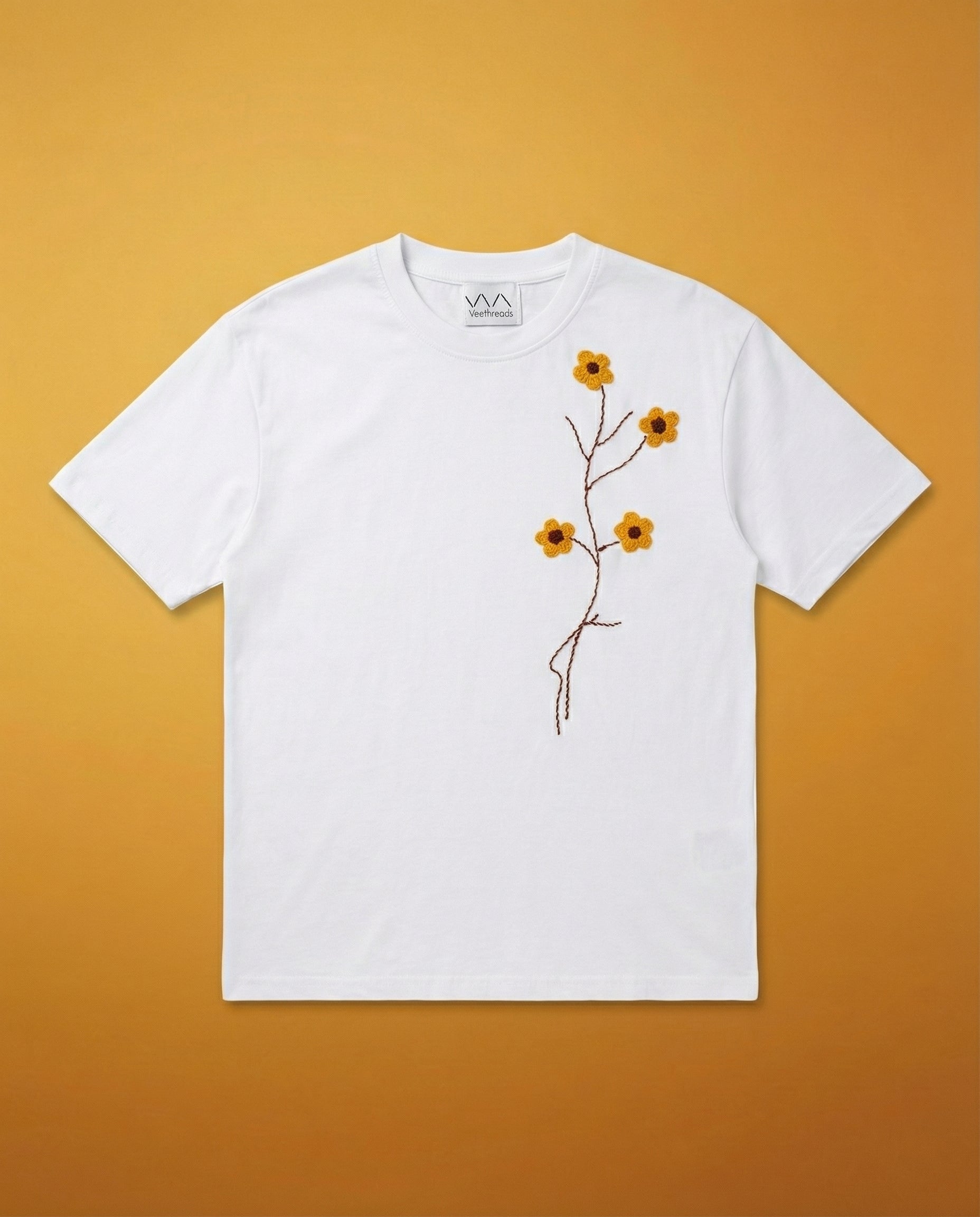 Yellow floral hand embroidery white shirt — white cotton tee with hand-embroidered yellow flowers and green leaves, oversized fit