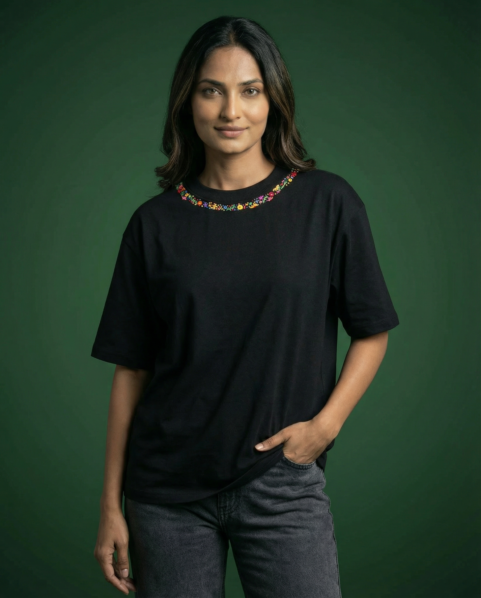 Hand embroidery on white shirt floral neckline — cotton tee with hand-stitched flowers framing the neckline, oversized fit
