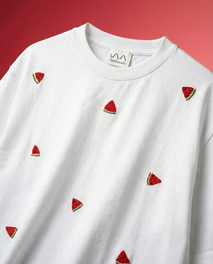 White t-shirt with watermelon slice embroidery patterns on a red background
