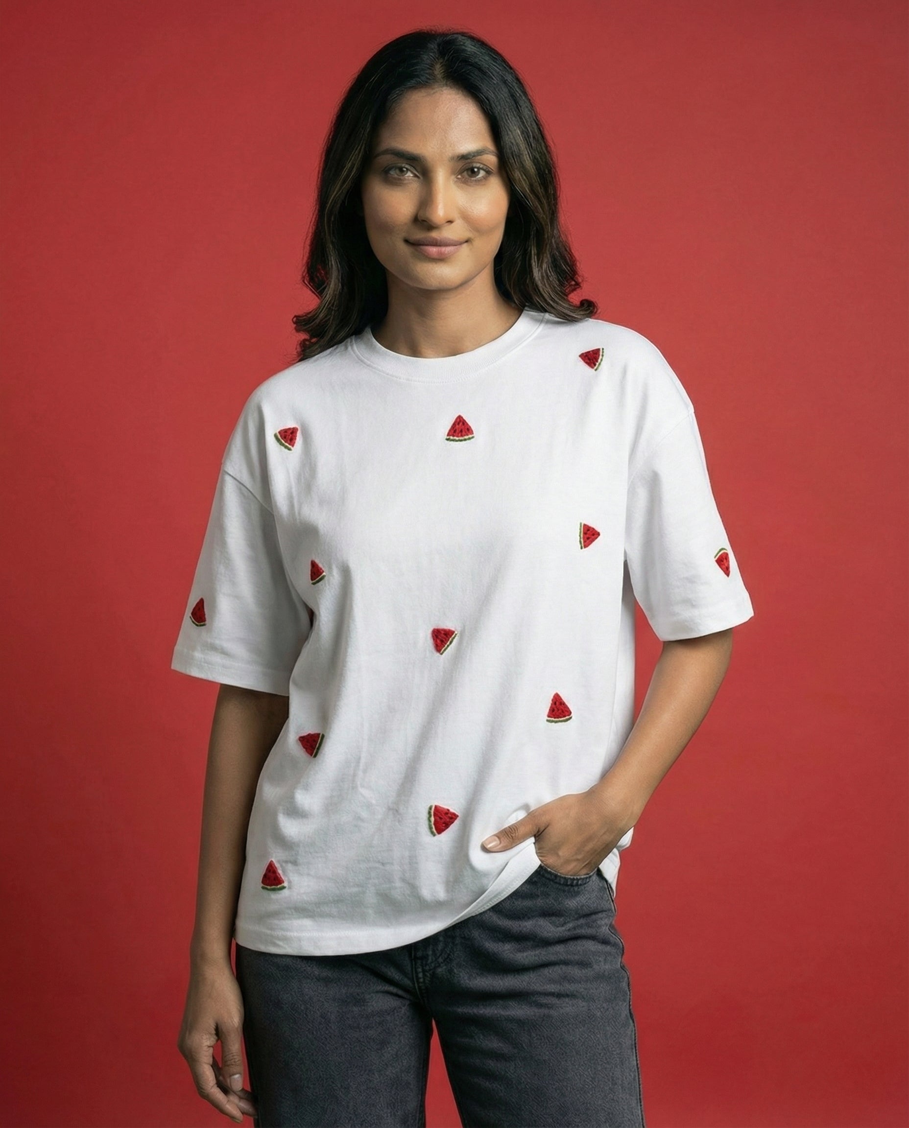 Woman wearing a white t-shirt with red triangle patterns against a red background