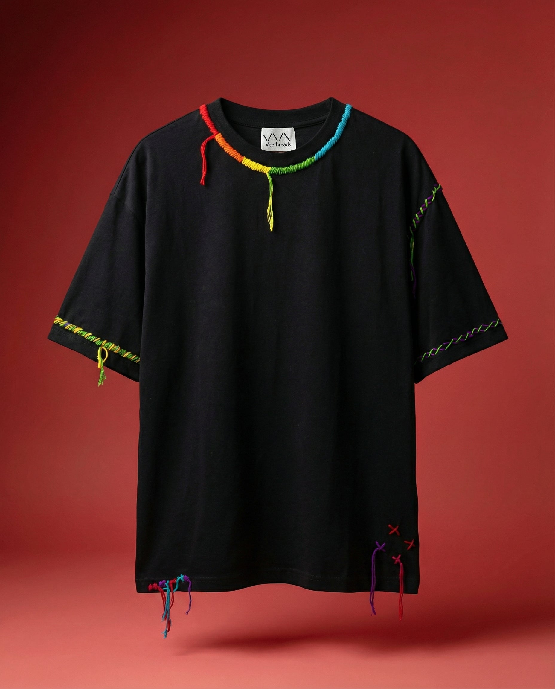 Concepteur kantha embroidery t-shirt — black cotton tee with colourful kantha-style trim hand-stitched along neckline