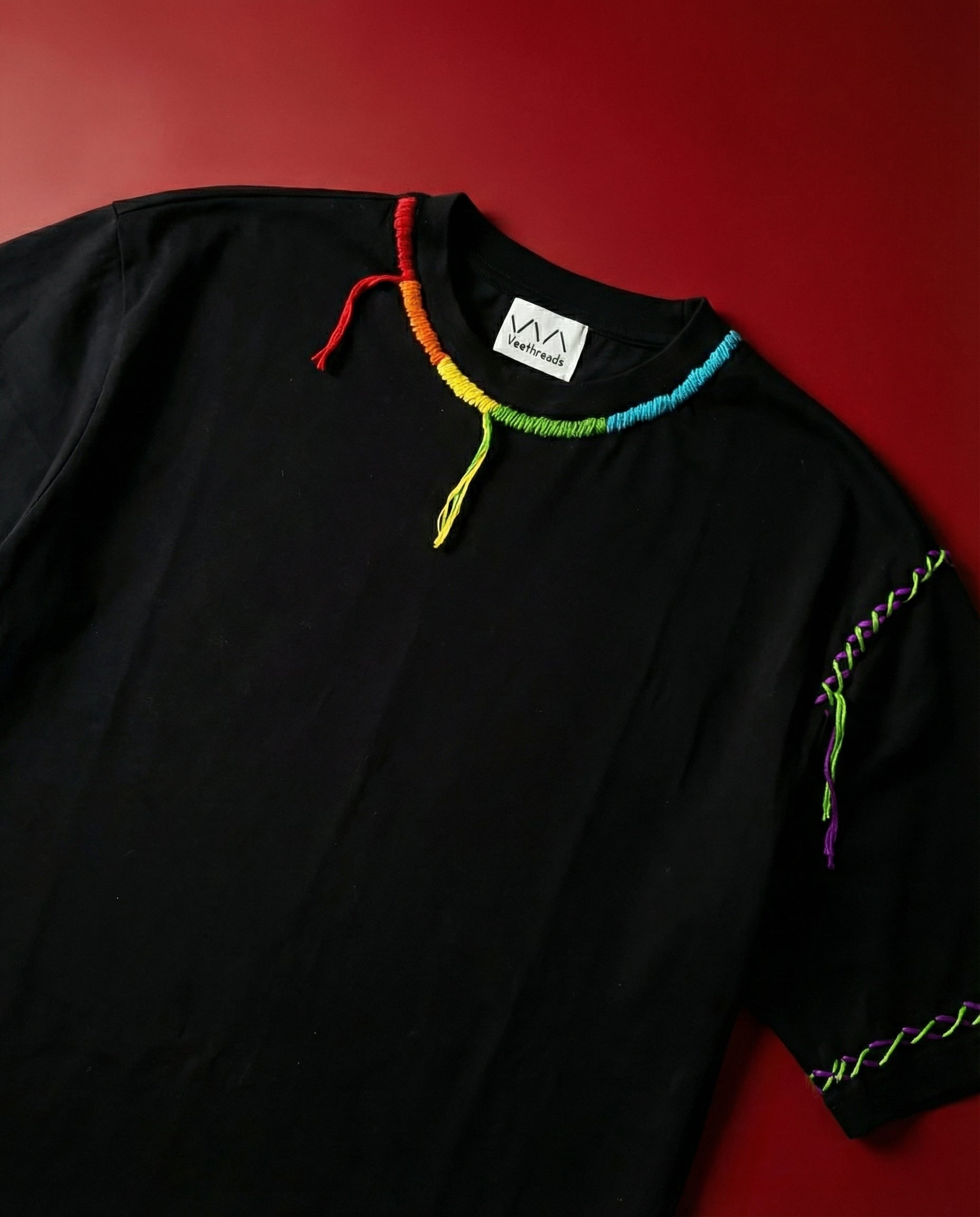 Hand embroidered kantha tshirt — black tee with colourful kantha trim on neckline, traditional Indian embroidery technique