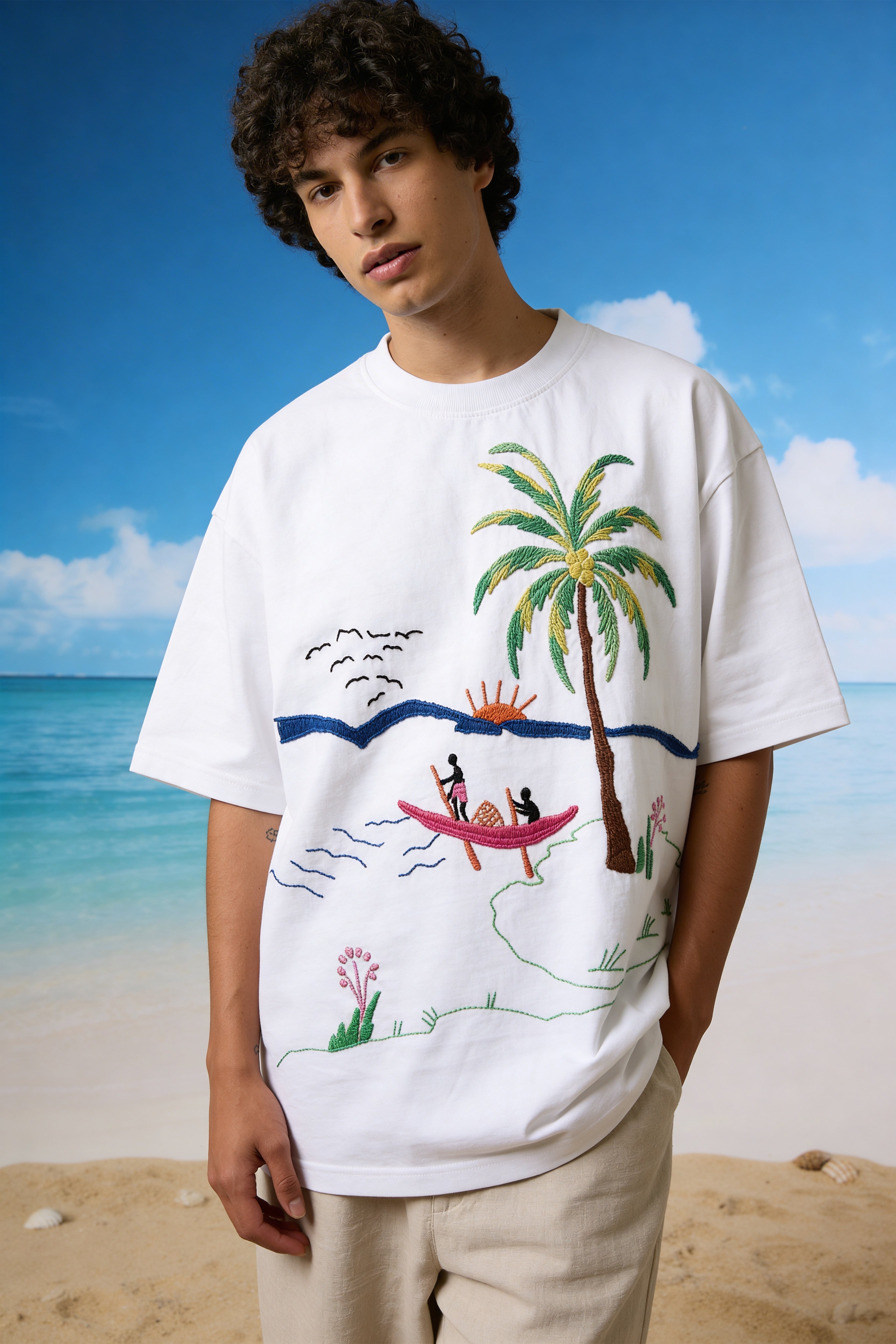 Person wearing a white t-shirt with a Beach t shirts mens oversized fit with handcrafted tropical embroidery design