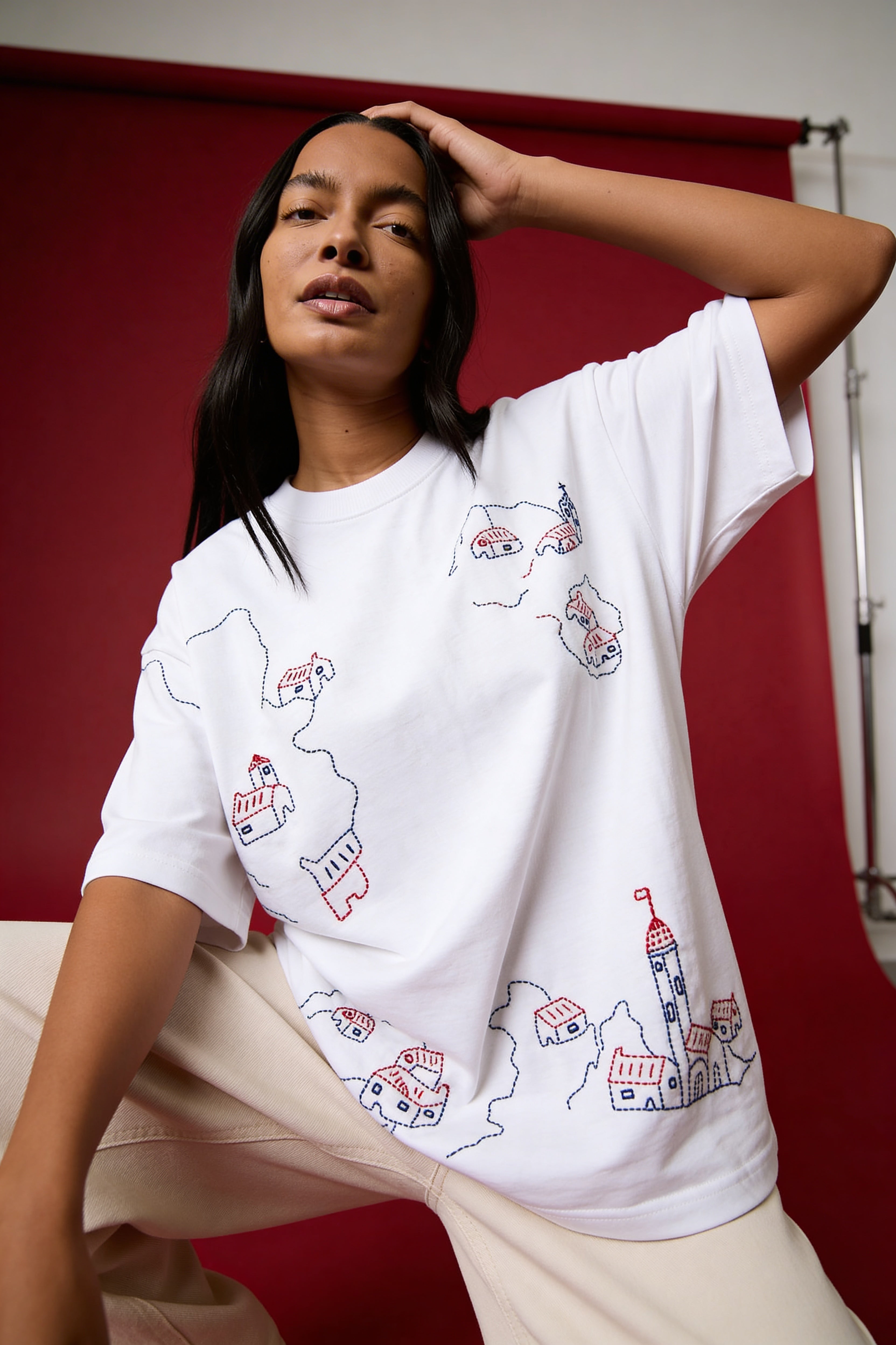 fashion model wearing oversized embroidered tshirt handcrafted cotton shirt