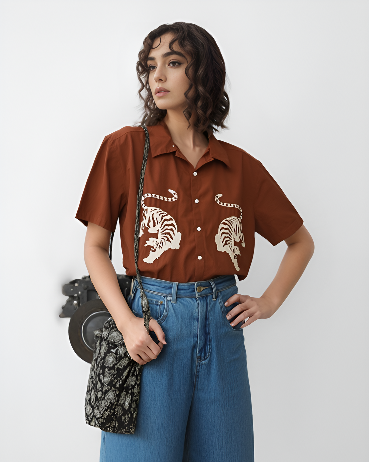 Thread-painted tiger fur built from overlapping stitches on a hand embroidered men's shirt