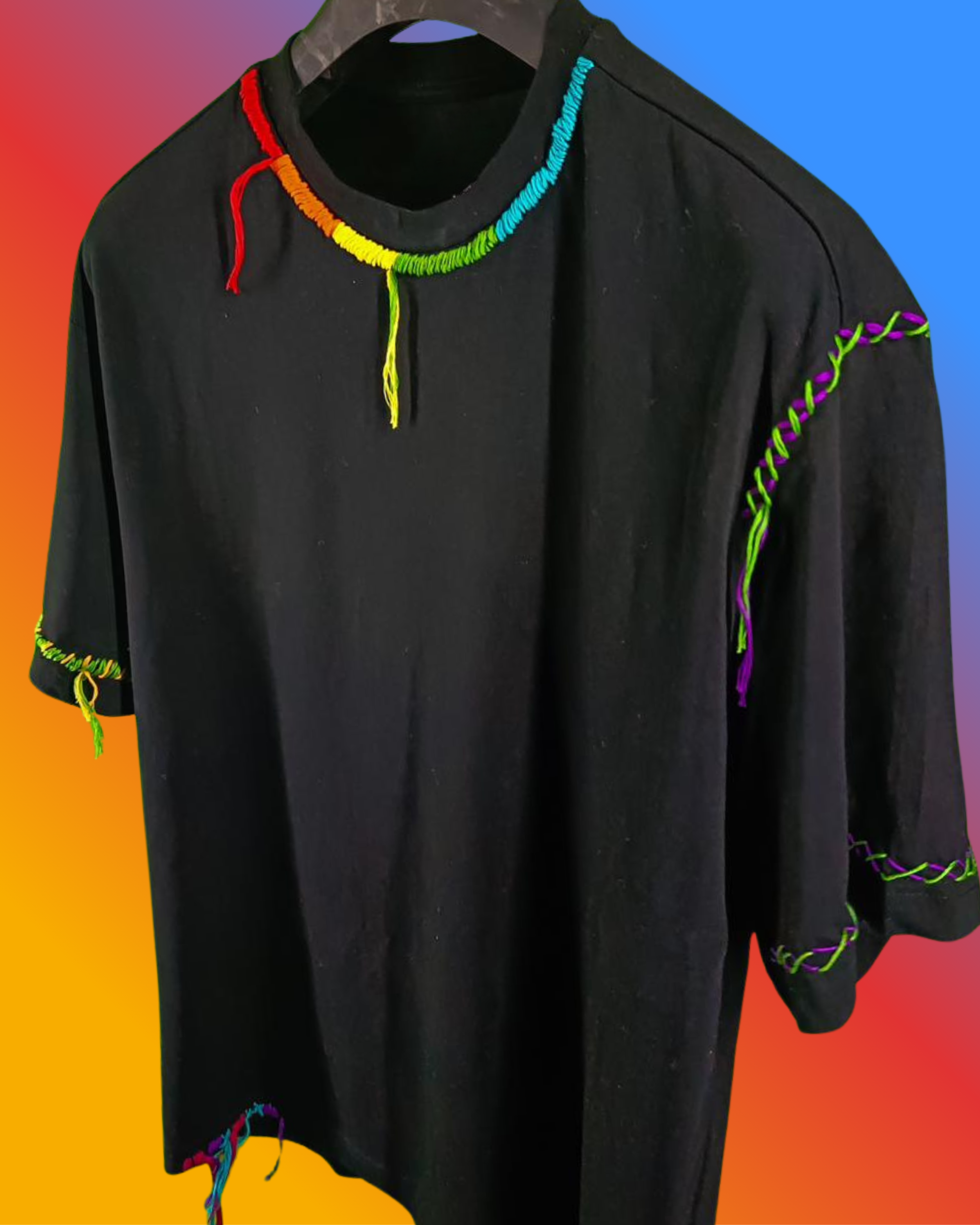 Black shirt with colorful trim on a gradient background