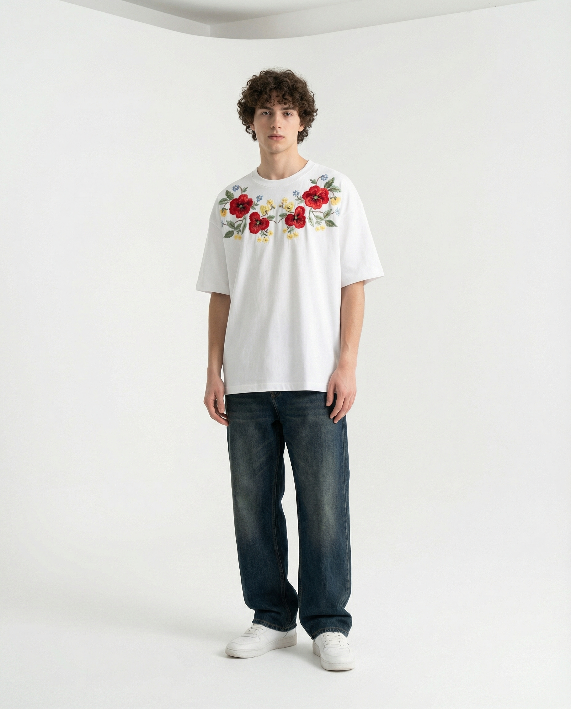 Person wearing a Classic embroidered shirts with detailed red flower and green vine embroidery