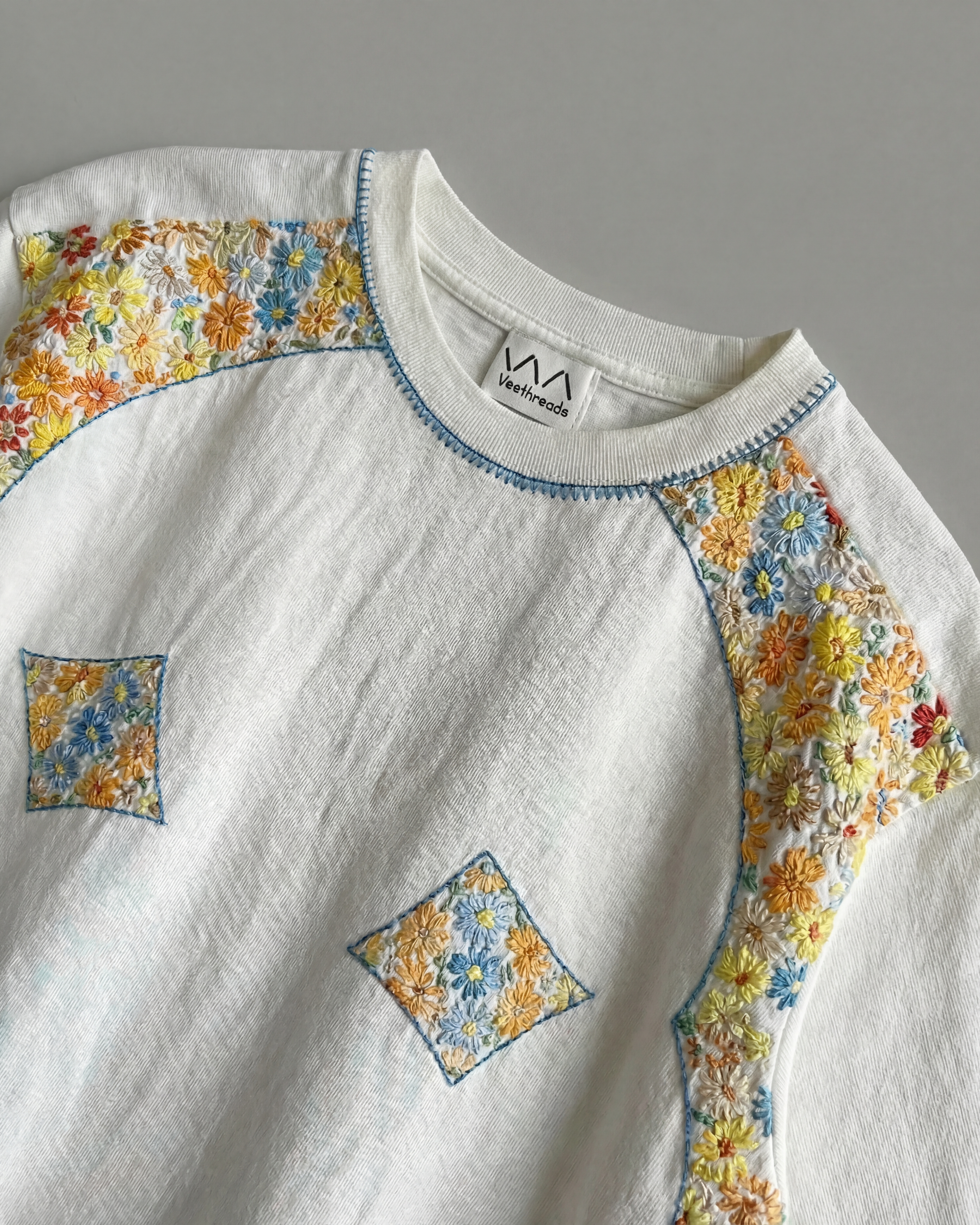 embroidered shirt flat lay 