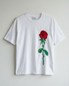 White t-shirt with a red rose hand embroidered  on a light gray background