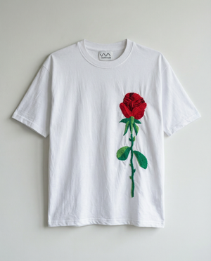 White t-shirt with a red rose hand embroidered  on a light gray background