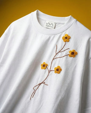 Hand embroidered yellow floral white cotton t-shirt — white tee with yellow floral vine hand-stitched in real thread on cotton