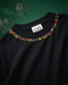 Hand embroidered floral shirt — neck floral blossom hand-embroidered cotton tee with delicate florals around the neckline, oversized unisex fit