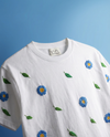 Azure bloom hand embroidered oversized tee — white cotton tee with blue floral hand-stitched embroidery on chest, oversized unisex fit