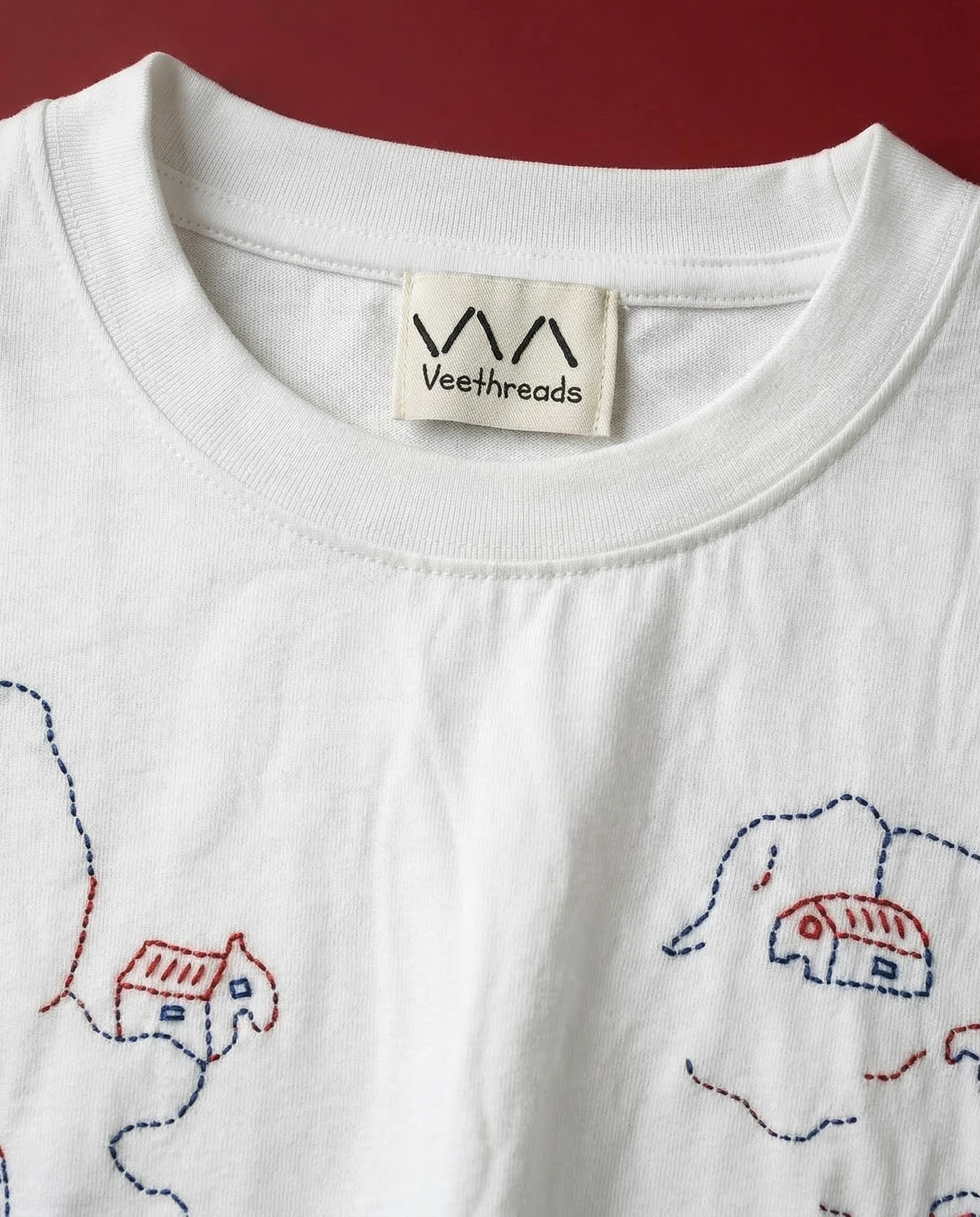 detailed hand embroidered houses stitching on premium cotton tshirt