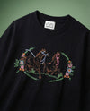 Wild prairie horse embroidered sweatshirt — black sweatshirt with hand-embroidered prancing horses and floral wreath on green background