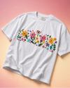 flat lay of white hand embroidered with floral design