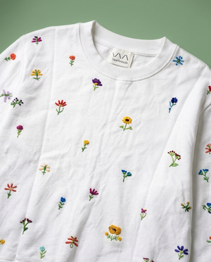 sweater shirt with hand embroidered flowers oall over it