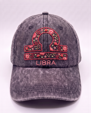 Libra zodiac cap, coral scales glyph hand-embroidered with gold stars on acid-wash denim