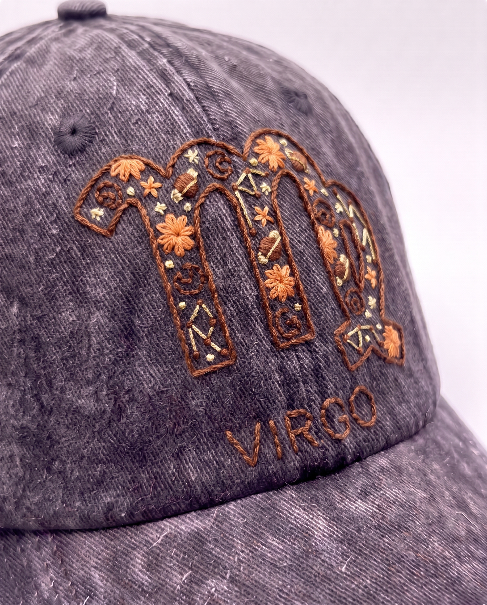 Virgo zodiac cap from the Vee Threads all signs range, rust brown glyph on acid-wash denim