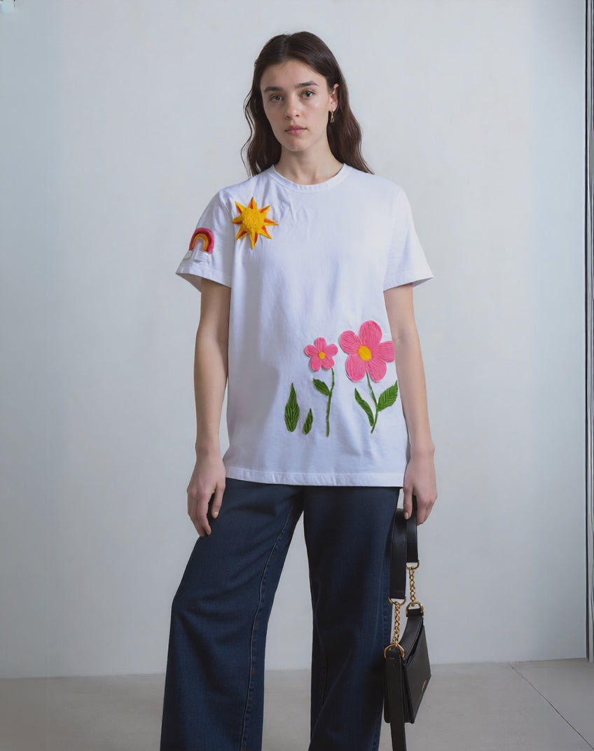 Model wearing a floral hand-embroidered oversized t-shirt 